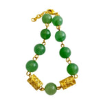 bracelet or et pierre verte